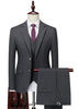 Gray pinstripe suit with a purple tie on a mannequin against a white background