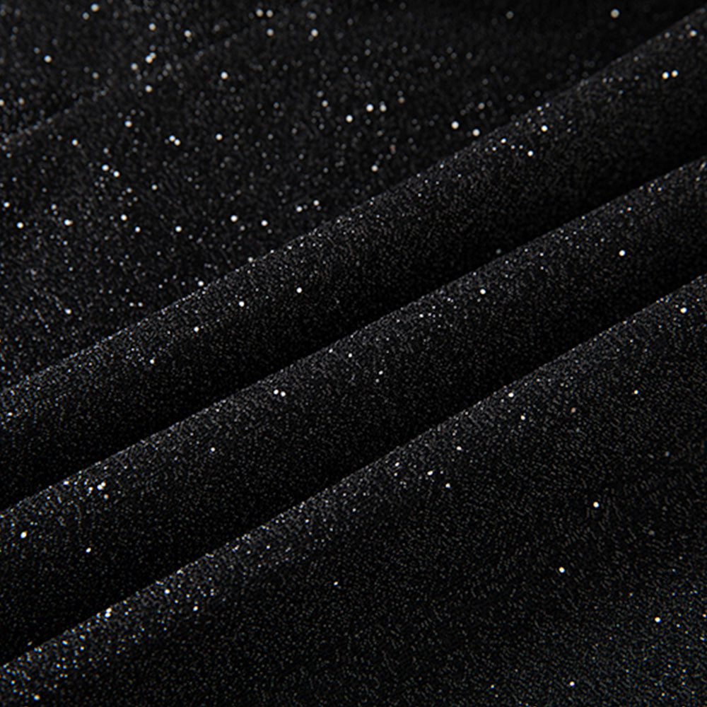  Detail view of black micro-glitter fabric texture and velvet covered buttons 