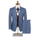 A three-piece men's suit is the main subject, presented on a mannequin against a plain white background. The suit is a light blue with subtle pinstripes and consists of a jacket, vest, and trousers. The jacket is buttoned and features two front pockets and a lapel pin. The vest is a dark brown, with a button closure, visible beneath the jacket. A patterned tie with brown and orange colors is knotted and visible, and a white dress shirt is visible under the vest and jacket. The trousers are folded neatly, ha