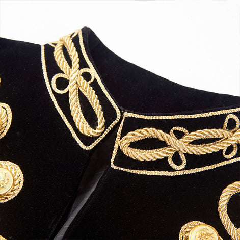 Close up of black velvet stand collar with gold rope trim details