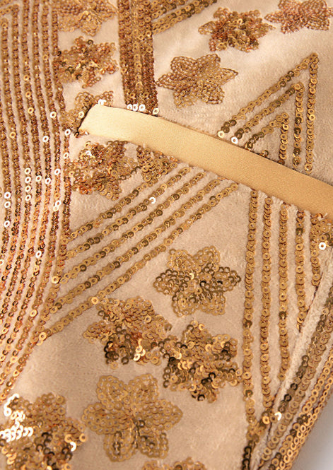 Detail view of champagne gold floral jacquard and sequin fabric texture