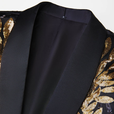 Close up of black satin shawl lapel and gold sequin leaf embroidery on tuxedo jacket |