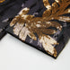 Close up of matching gold sequin leaf embroidery at the hem of tuxedo pants