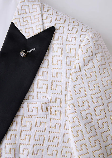 Close up of embossed gold geometric weave texture and black satin peak lapel - Nevo Suits