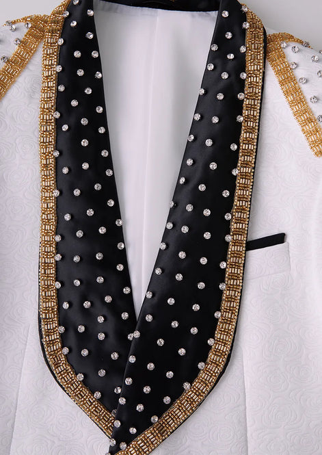 Close up of black satin shawl collar with gold beaded edge and crystal details