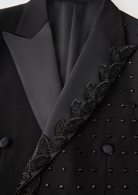 Close up of black sequin leaf vine embroidery and scattered crystals detail - Nevo Suits