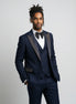 Man wearing Cobalt Starlight navy blue and gold crystal peak lapel tuxedo - Nevo Suits