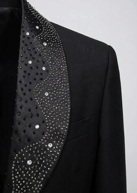 Macro photography of black suit fabric and shimmering rhinestone clusters