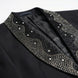Detail view of wavy crystal pattern on black satin shawl lapel of Nevo tuxedo