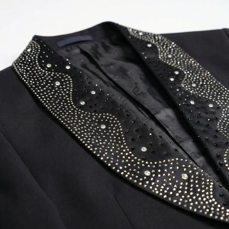Detail view of wavy crystal pattern on black satin shawl lapel of Nevo tuxedo