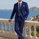 Ink Crownline royal blue double-breasted suit at a coastal terrace