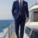 Ink Crownline royal blue 2-piece suit walking on a yacht