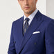 Ink Crownline royal blue peak lapel suit upper-body studio portrait