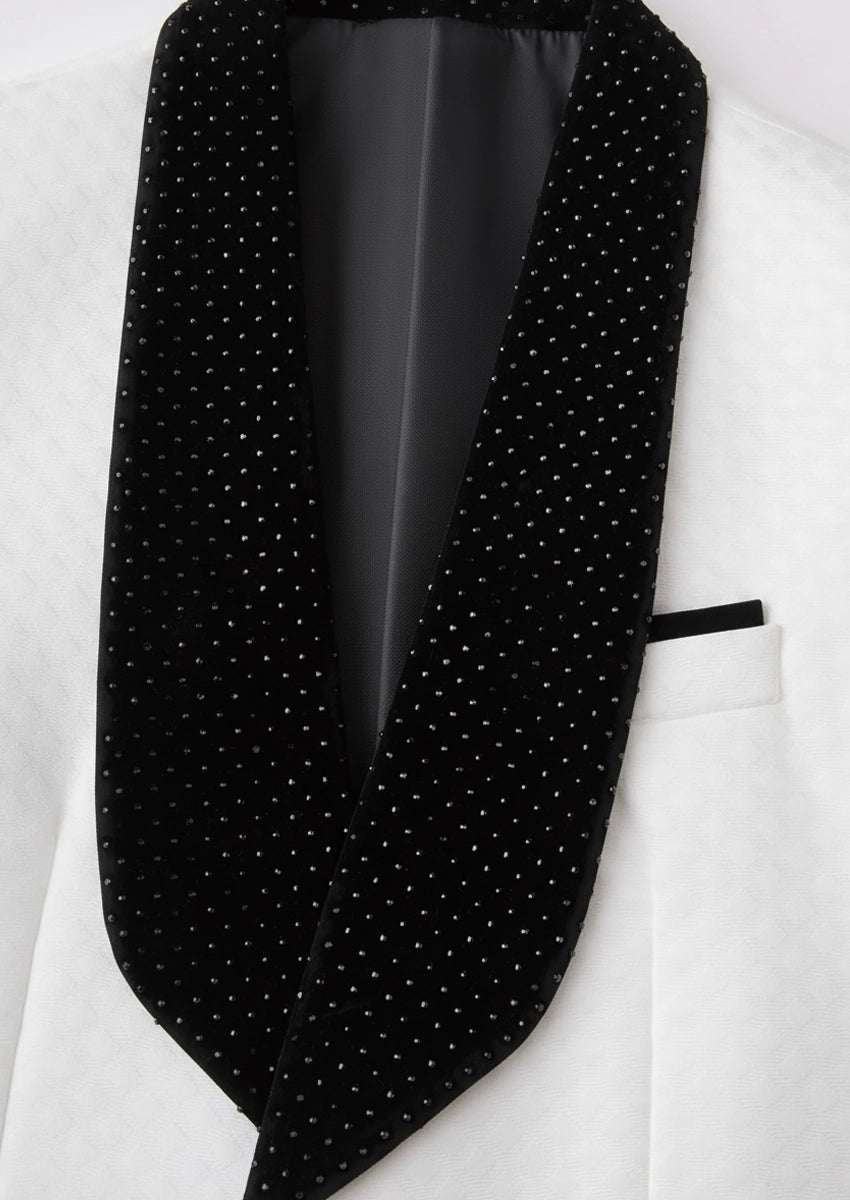 Close up of black velvet shawl collar with scattered crystals and velvet buttons detail - Nevo Suits