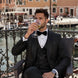 Man wearing The Regal Floral Black jacquard tuxedo with oversized shawl collar for prom - Nevo Suits