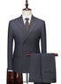 Gray double-breasted suit on a mannequin with a white shirt and brown tie.