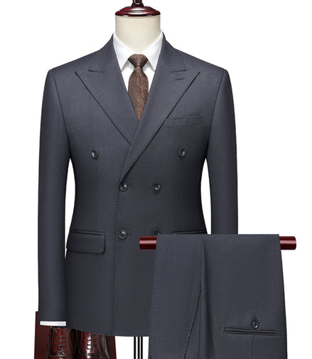 Gray double-breasted suit on a mannequin with a white shirt and brown tie.