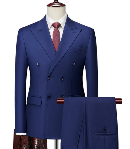 Blue suit on a mannequin with a white shirt and red tie against a white background