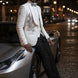 Man wearing The Celestial Pearl all white tuxedo with pearls and silver crystals for wedding - Nevo Suits