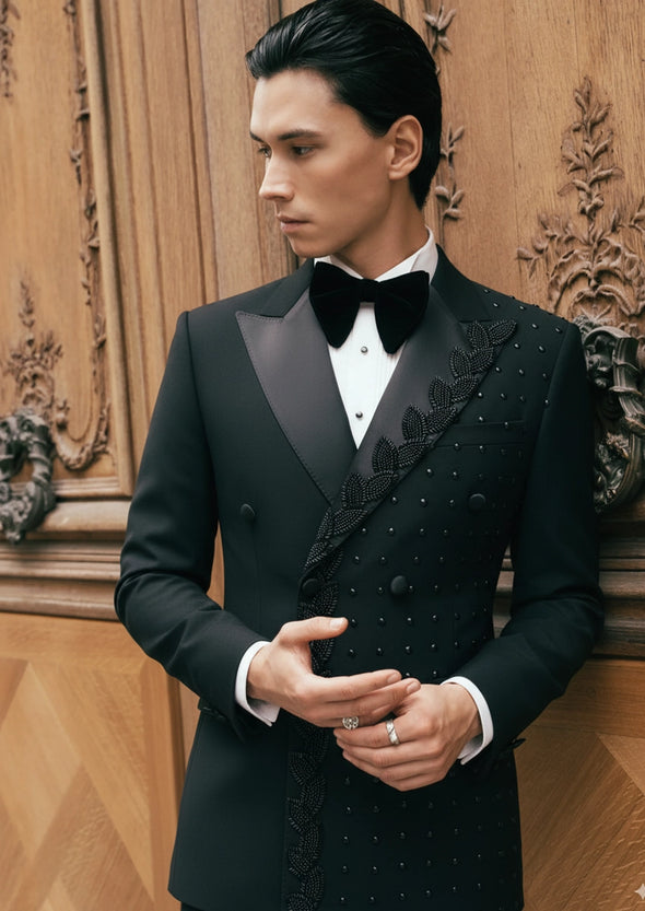Model wearing Phantom Vanguard black asymmetric beaded tuxedo with hand-beaded vine motif - Nevo Suits