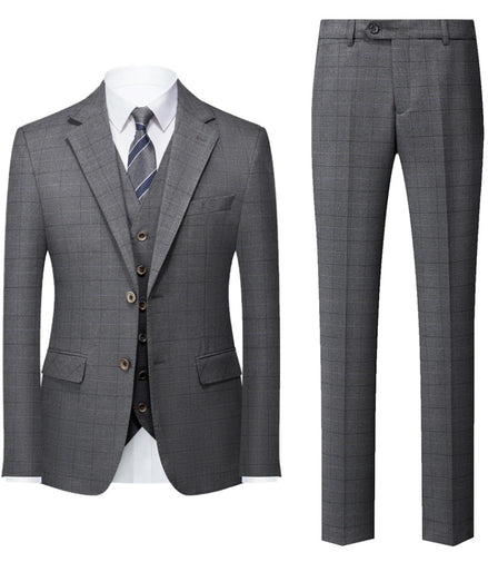 Gray checkered suit with jacket, vest, and pants on a white background