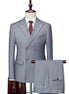 Gray double-breasted suit on a mannequin with a white shirt and red tie.