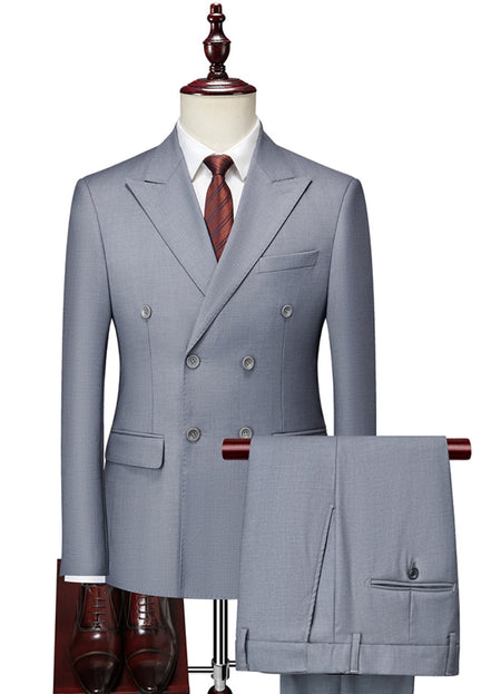Gray double-breasted suit on a mannequin with a white shirt and red tie.