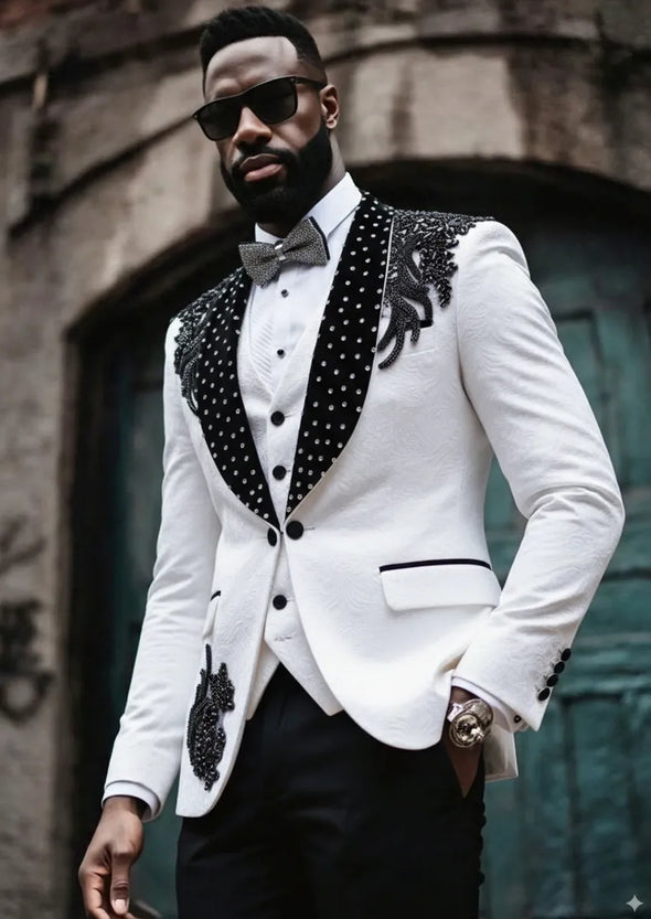 Man wearing The Onyx Wing white tuxedo with black beaded wing embroidery on shoulders - Nevo Suits