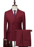 Maroon suit on a mannequin with a white shirt and patterned tie, on a white background.
