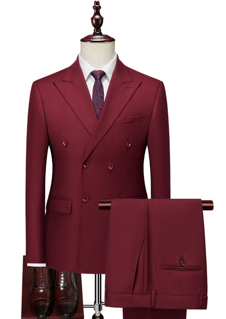 Maroon suit on a mannequin with a white shirt and patterned tie, on a white background.