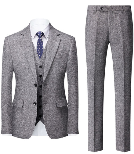 Gray suit with jacket, vest, and pants on a white background