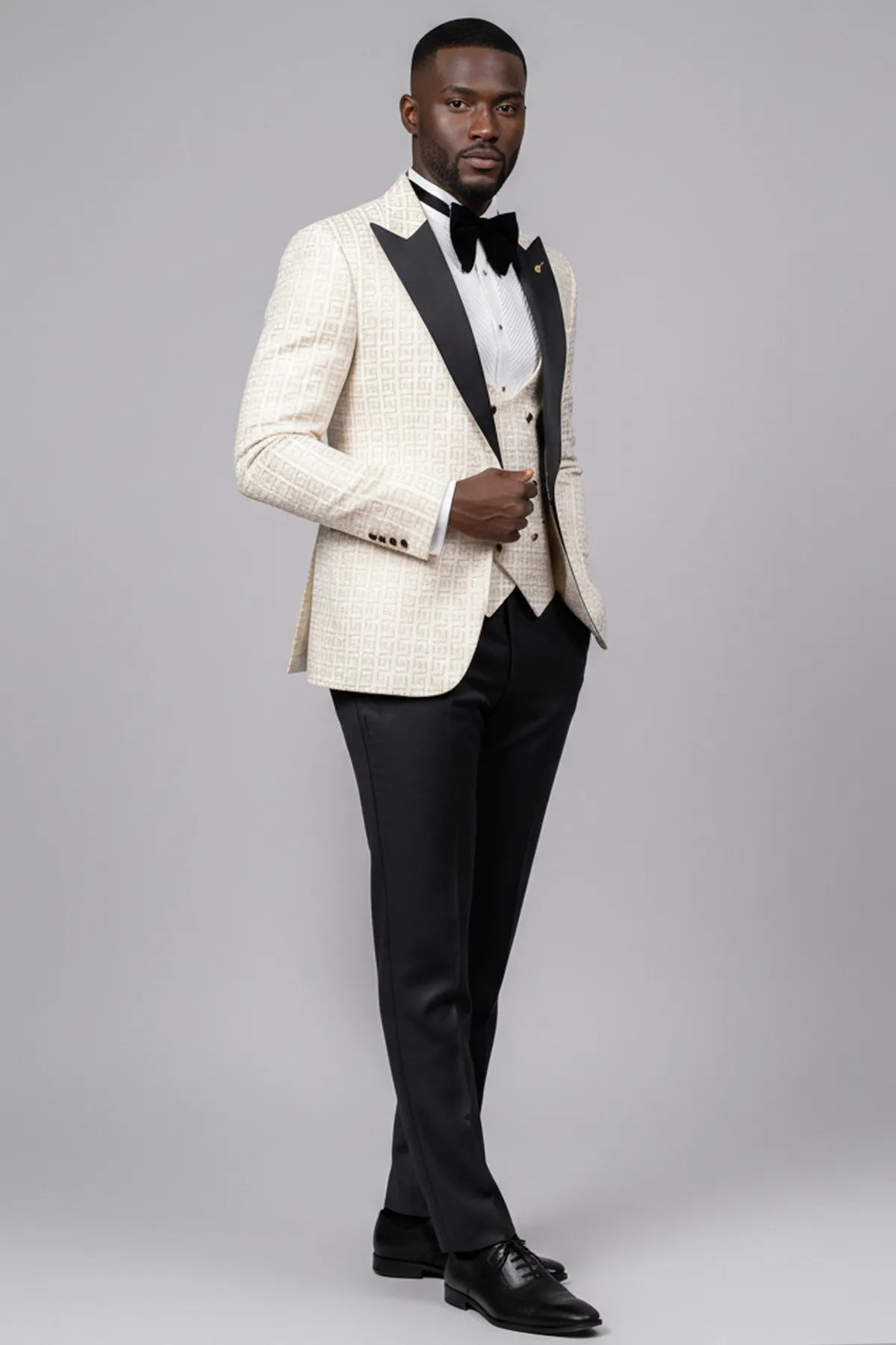 Full front view of Ivory Nebula white and gold geometric jacquard tuxedo with black peak lapel and vest - Nevo Suits