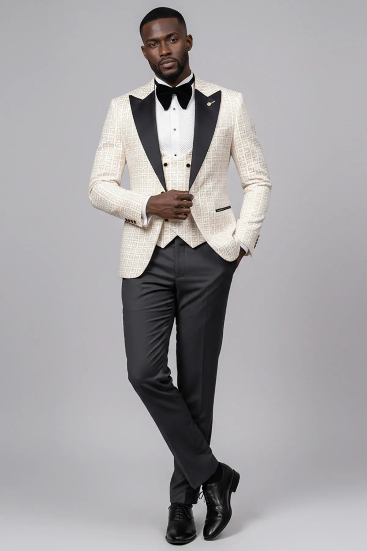 Full front view of Ivory Nebula white and gold geometric jacquard tuxedo with black peak lapel and vest - Nevo Suits