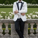 Full front view of Ivory Nebula white and gold geometric jacquard tuxedo with black peak lapel and vest - Nevo Suits