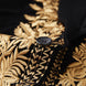 Black button detail on gold embroidered velvet tuxedo
