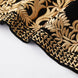 Gold embroidered hem detail on black velvet jacket
