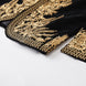 Gold embroidered hem detail on black velvet jacket
