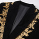 Close up of gold fern leaf embroidery on black velvet peak lapel
