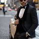 Man wearing The Onyx Royale black 3D diamond jacquard tuxedo with velvet lapel for prom - Nevo Suits