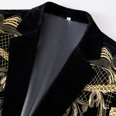 Black velvet peak lapel detail on gold embroidered tuxedo